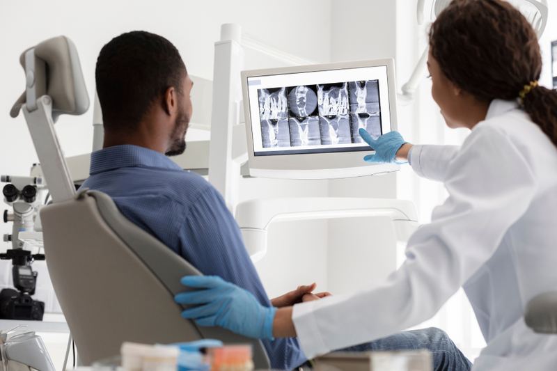 Doctor reviewing x-rays with her patient